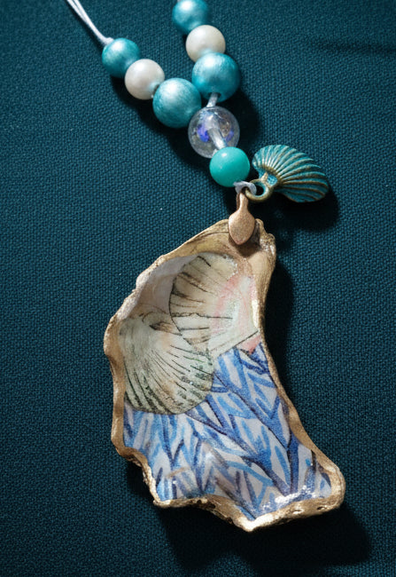 Scallop and seaweed - with brass scallop charm- on oyster shell