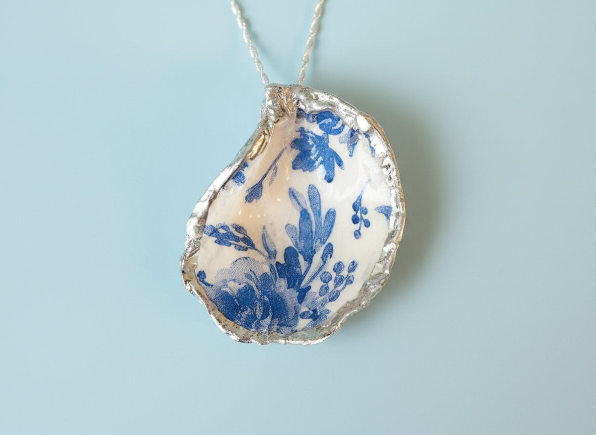 Decorative oyster shell with blue floral pattern