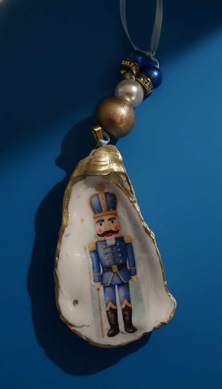Decorative ornament with a nutcracker figure inside an oyster shell