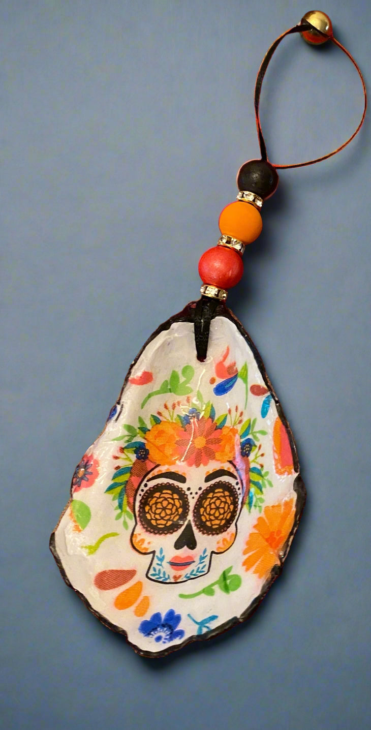 Decorative shell charms with beads on a red fabric background