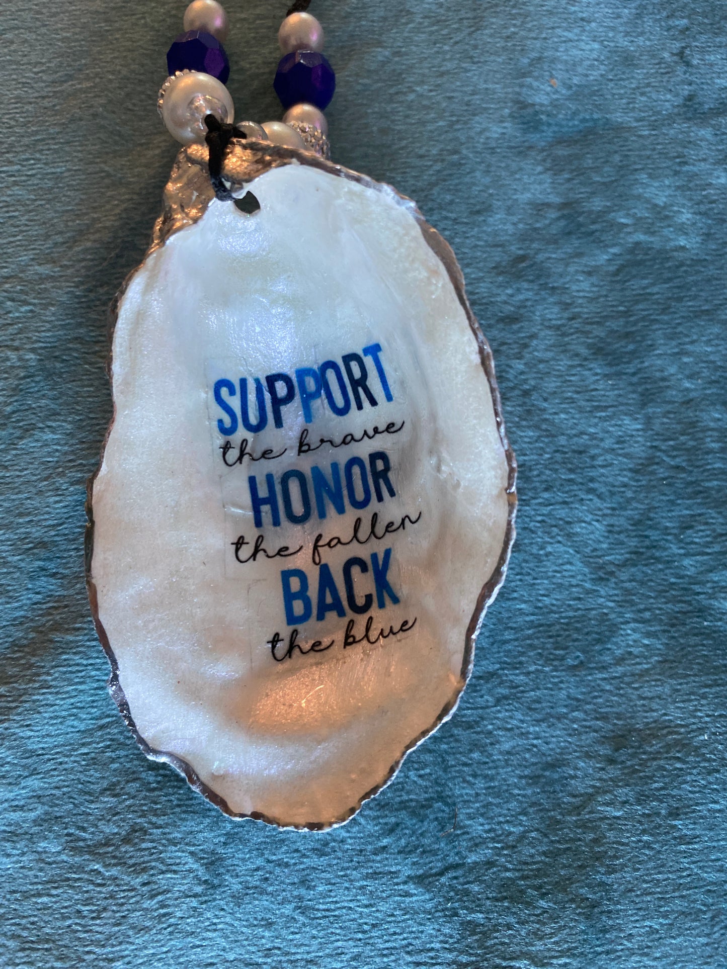 “Support the brave/ Honor the fallen/ Back the blue”- oyster shell