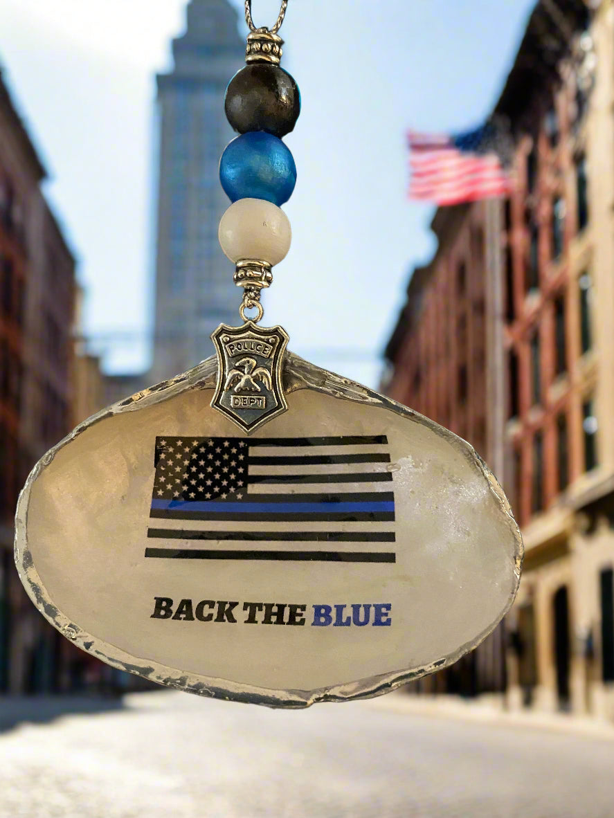 Decorative item with 'Back the Blue' flag design on a dark background
