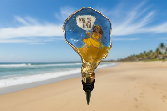 Decorative bottle stopper with a beach scene design on a sandy beach with ocean view