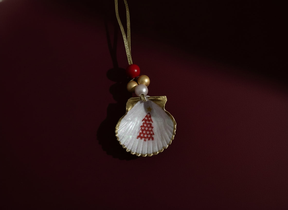 Shell ornament with red tree design