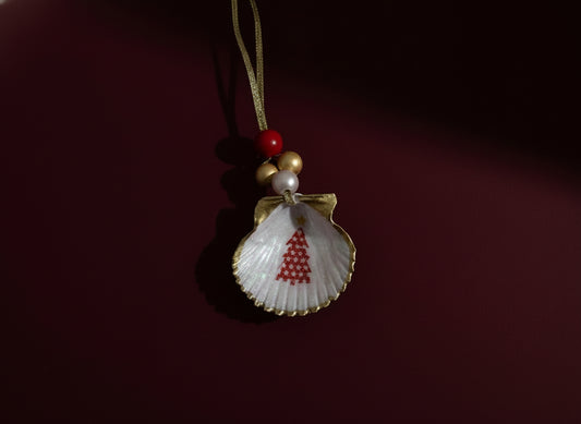 Shell ornament with red tree design