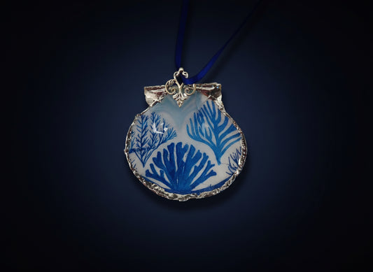 Decorative ornament with blue coral design on a blue background