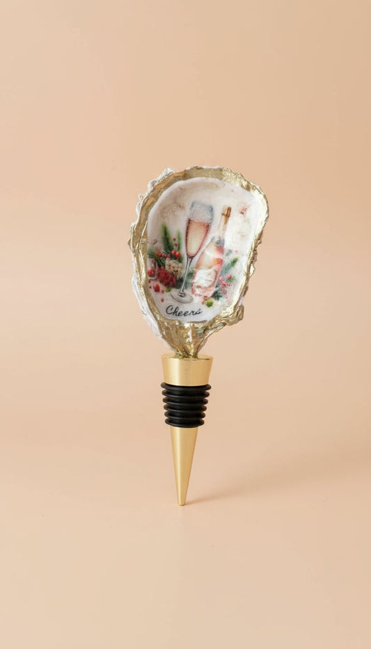 Decorative oyster shell bottle stopper with a design 