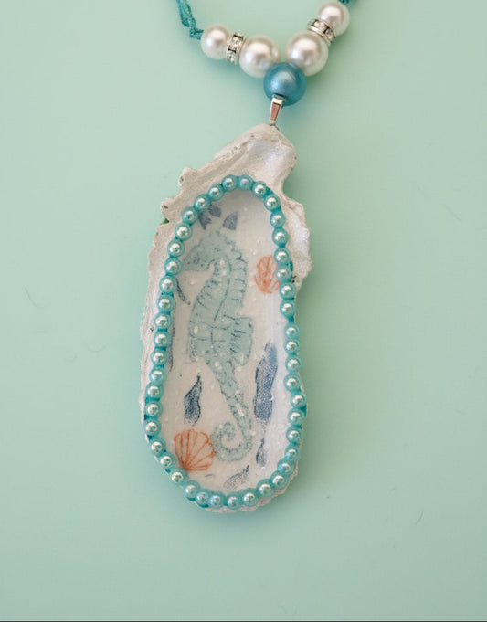 Seashell with seahorse design and beads