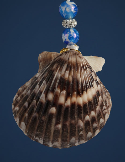 Shell ornament with blue beads